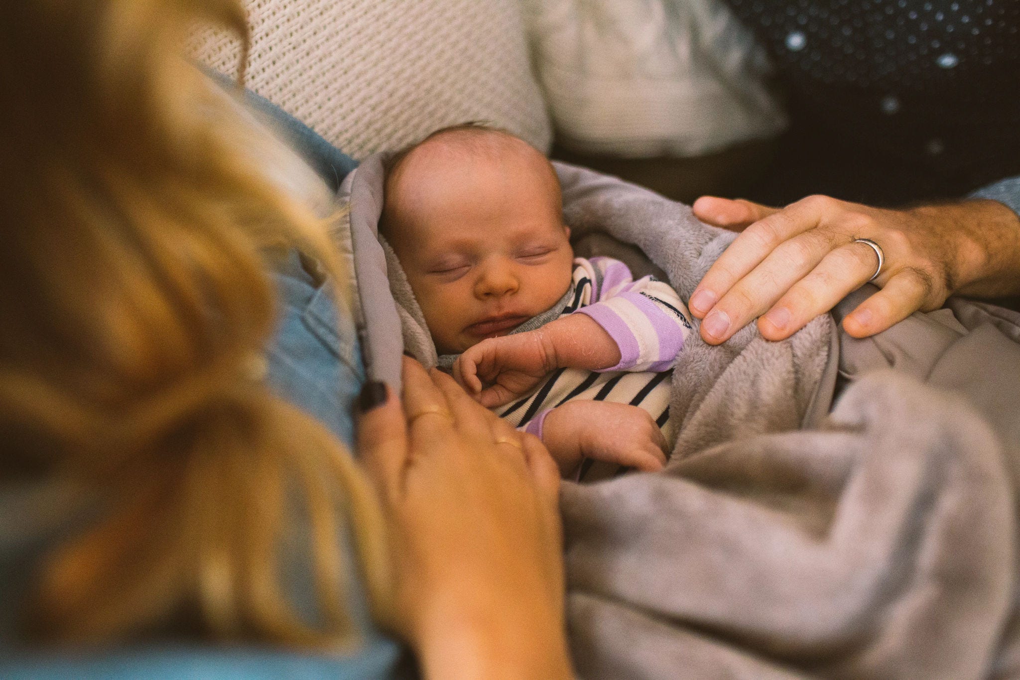 parents-looking-down-baby